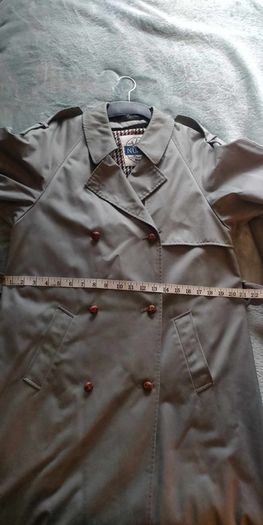 Vintage Nuage ladies trenchcoat Approximately late 90s early 00s Size 10 on label The colour is a pale bluey grey with brown buttons It's got an inner lining that can be removed