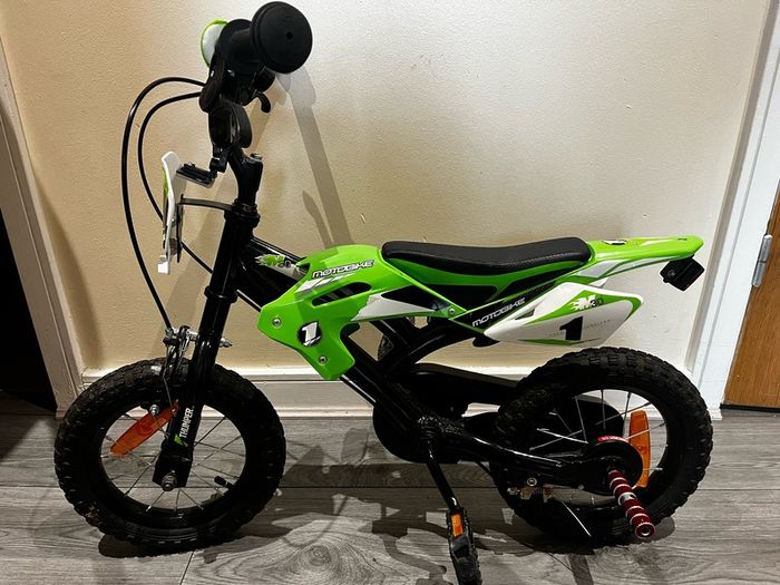 Boys green bike