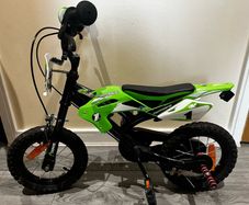 Boys green bike
