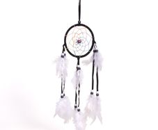 Black dream catcher with white feathers