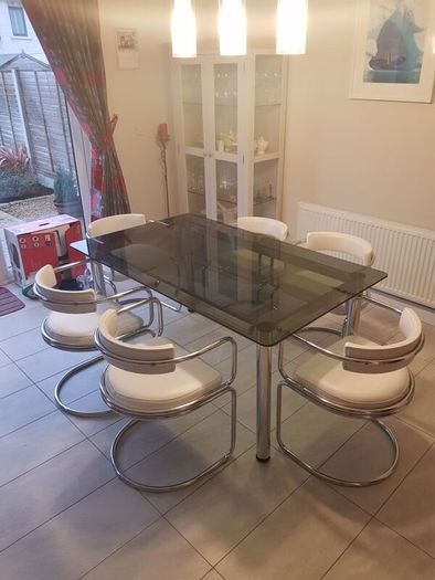 Table and 6 white leather chairs