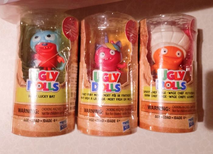 3 Ugly Dolls In Plastic Case (new).