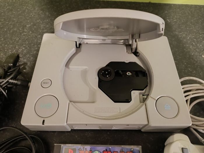 Playstation 1 with controller and game