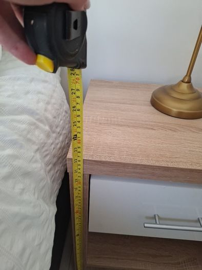 Timer and white wardrobe and bedside locker