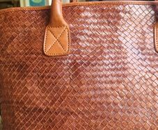 brown leather woven shoulder bag
