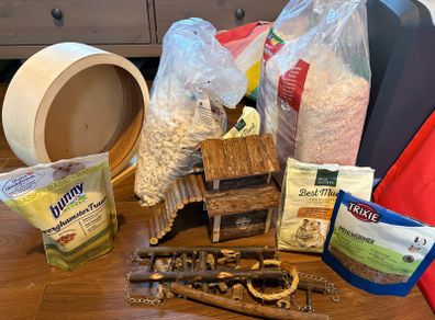 Hamster food, housing, litter and wheel
