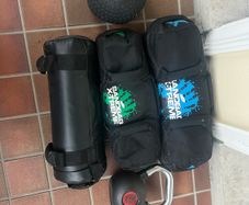 Sandbags, kettlebell, medicine ball