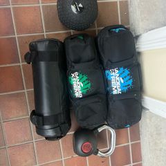 Sandbags, kettlebell, medicine ball