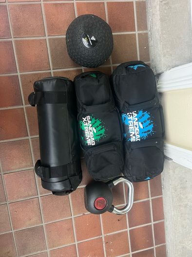 Sandbags, kettlebell, medicine ball