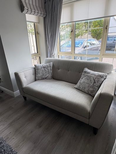 Modern two-seater sofa in light grey fabric