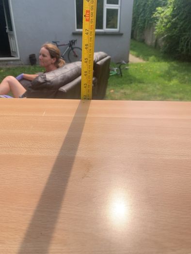 Adjustable height table for the infirm