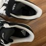 Black and white adidas shoes Image 4