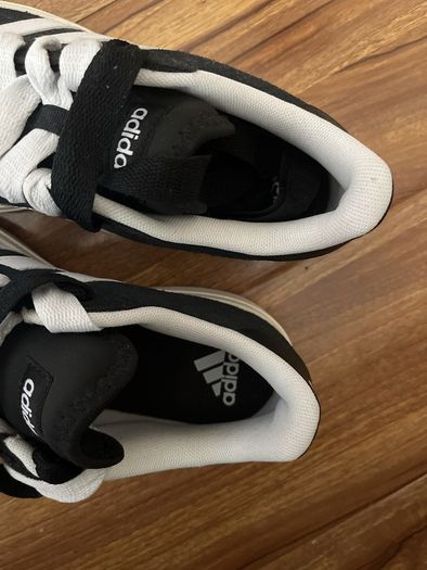 Black and white adidas shoes