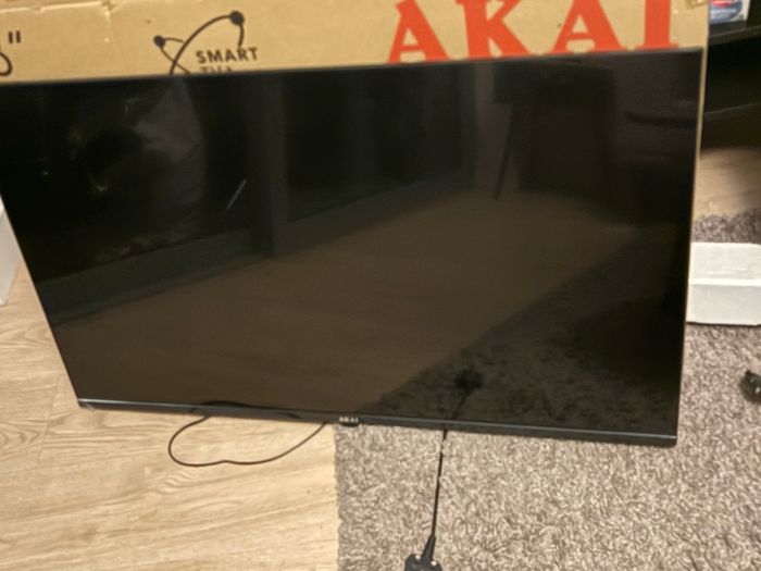 Tv with no remote (button can be used) and no stand.. Box included
