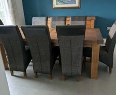Large oak extendable dining table and 8 chairs