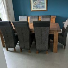 Large oak extendable dining table and 8 chairs