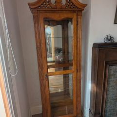 Ornate oak display cabinet with light. 5 glass shelves, mirror back