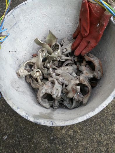 Bucket of scaffolding parts
