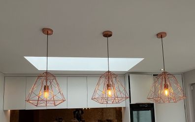 Three Copper Kitchen island pendant lights cage