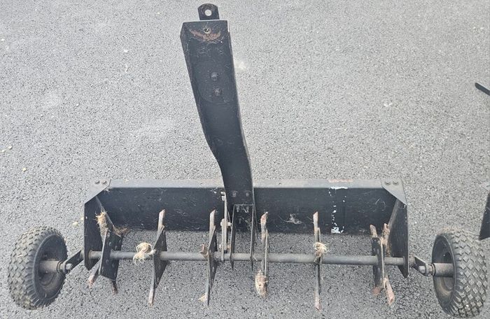 Tow behind lawn aerator