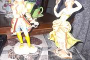 A Pair of Italian Depose Figurines The figurines depicts a 18th century Rococo style attire