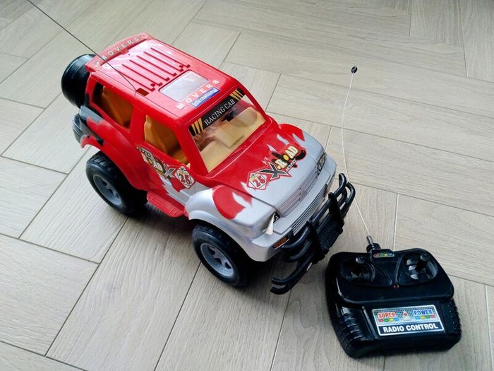 3 remote control vehicles & 1 blue racecar with lights & sounds