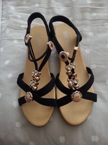 ladies black and gold sandals