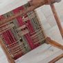 Antique wooden footstool with woven seat Image 5