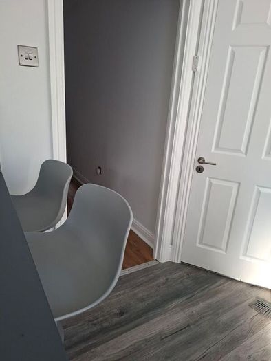 Two adjustable grey breakfast bar stools