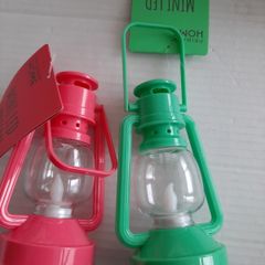 2 small plastic garden lanters tags attached