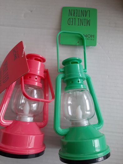 2 small plastic garden lanters tags attached