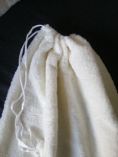 small cream fleece pullstring bag