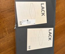 two IKEA black LACK shelves