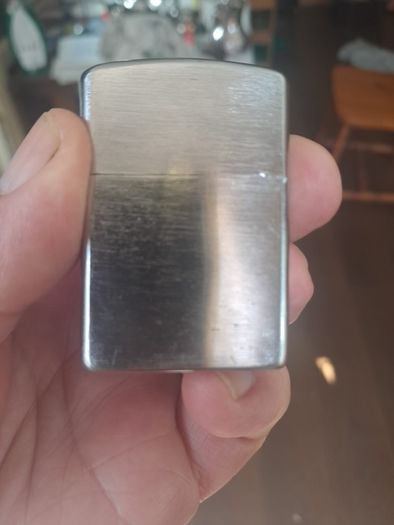 Champ Flip top petrol lighter.