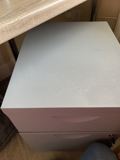 Grey lockable filing cabinet on castors