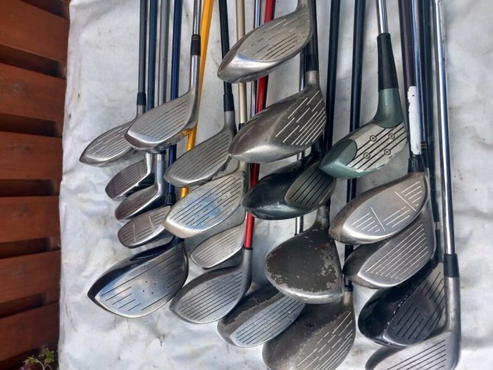 A selection of golf clubs and bags. Golf balls