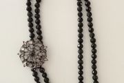 Black-Beaded Necklace with Broach Detail