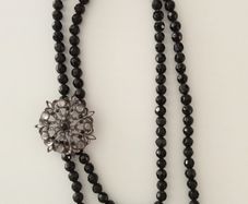 Black-Beaded Necklace with Broach Detail