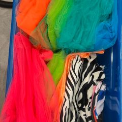 Box of assorted colourful tulle and fabric materials