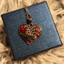 Heart-Shaped Pendant Necklace with Red Glass Heart and Wing Details Image 8
