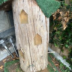 Fairy house perfect for little girl, made from tree trunk & carved out windows & swing, just needs some maintenance