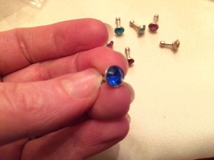 Brand new 8 pack of diamond plug in dust covers for phone and tablets