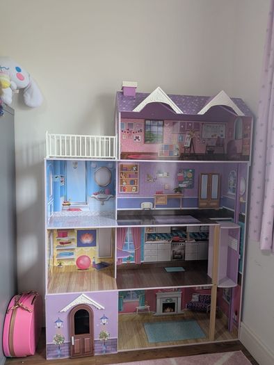Large wooden dolls house with furniture