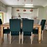 West Elm Solid wood Dining Table and velvet sprung chairs x 6 Image 5