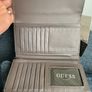 Guess purse. Never used. Slightly worn on inside due to storage. Image 4