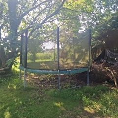 FREE 12ft trampoline to take away. Needs a clean, net is good but a few clips on the bottom are broken. Few coin size holes in trampoline mat. A few of the screws to hold the steel uprights are missing, currently using zip ties. Must go all together, pick