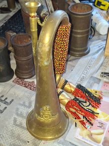 Antique Brass Military Bugle features a Distinctive Cap Badge