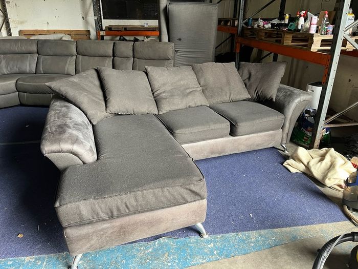 grey/black corner sofa with scatter cushions