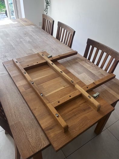 Solid oak dining table and chairs