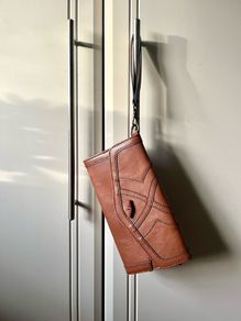 Johnny Loves Rosie clutch bag